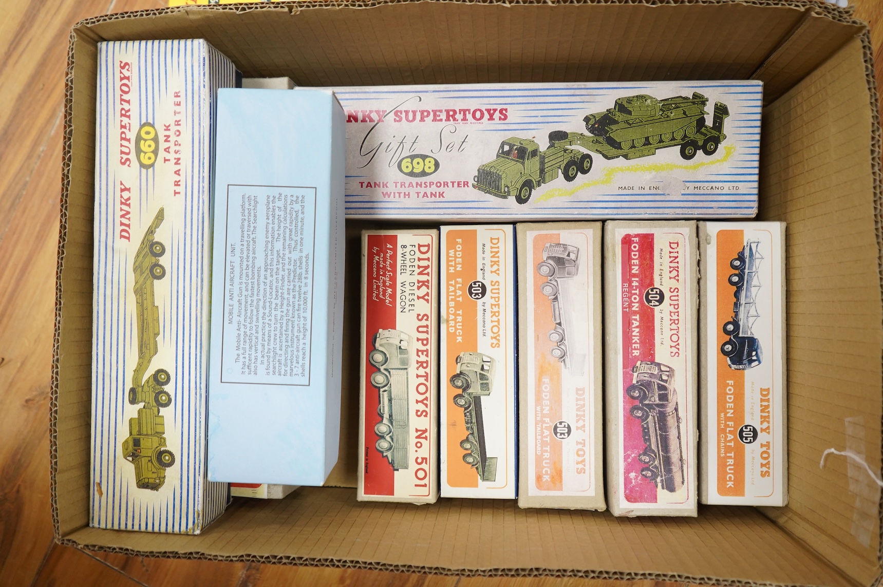 Twenty-three Dinky Toys and Supertoys, all playworn, restored, repainted or overpainted, (twelve in reproduction boxes), twelve aircraft, five Foden, 8-wheel commercial vehicles, a tank transporter with Centurion tank, a